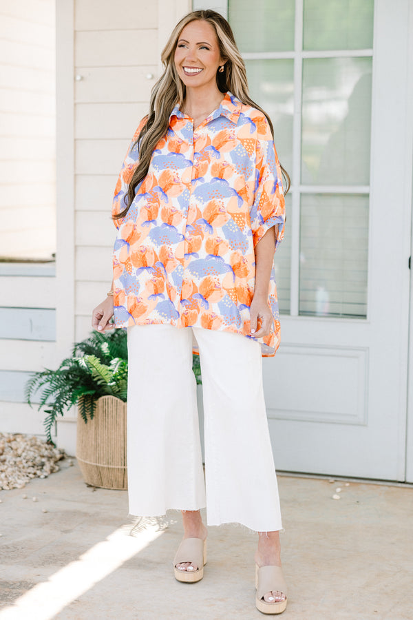Chic soul plus size clothing, orange button-up top with a floral pattern and half sleeves 