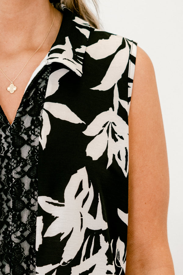 chic soul plus size clothing, black tank with a white floral pattern and a black lace strip down the center of the shir, it has a slight v-neckline 