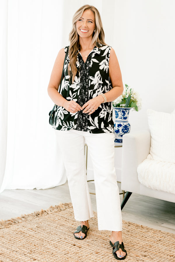 chic soul plus size clothing, black tank with a white floral pattern and a black lace strip down the center of the shir, it has a slight v-neckline 