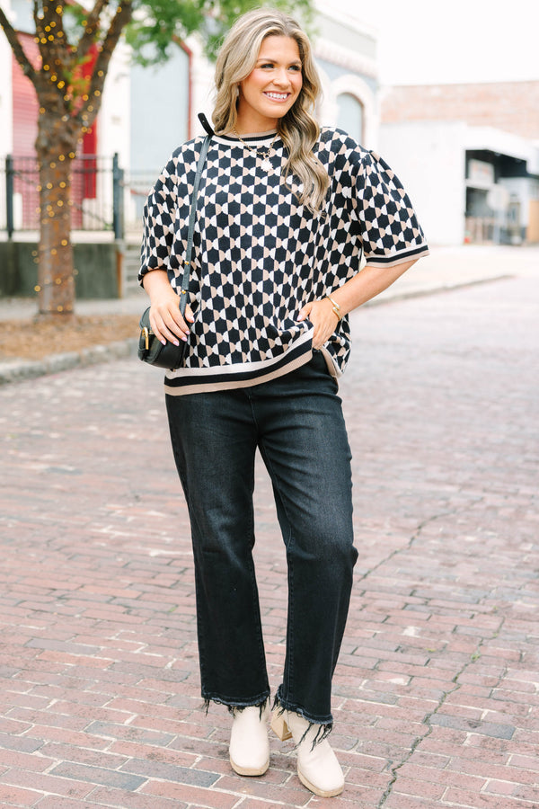 Plus Size black and tan geometric pattern short sleeve sweater with a crew neckline.
