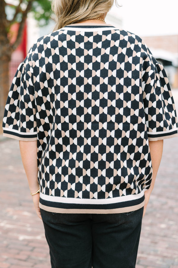Plus Size black and tan geometric pattern short sleeve sweater with a crew neckline.