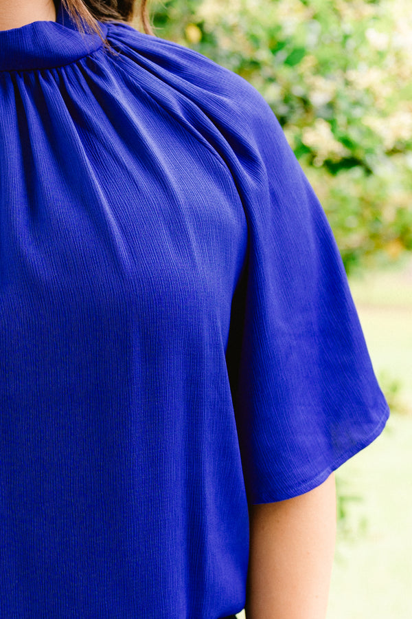 Chic Soul plus size clothing, royal blue blouse with a high neckline and flowy sleeves