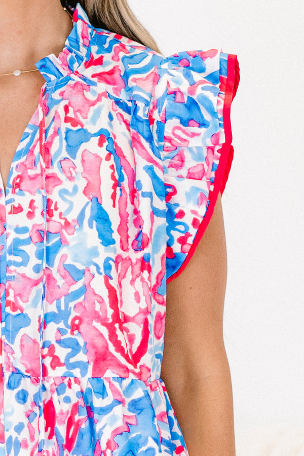 Chic Soul plus size clothing, blue and pink top with an abstract watercolor pattern and flutter sleeves that have a pink stitch around the end of the sleeves 