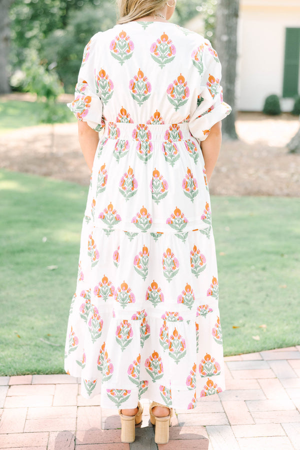 Plus Size white floral tiered maxi dress with short puff sleeves and a v-neckline.