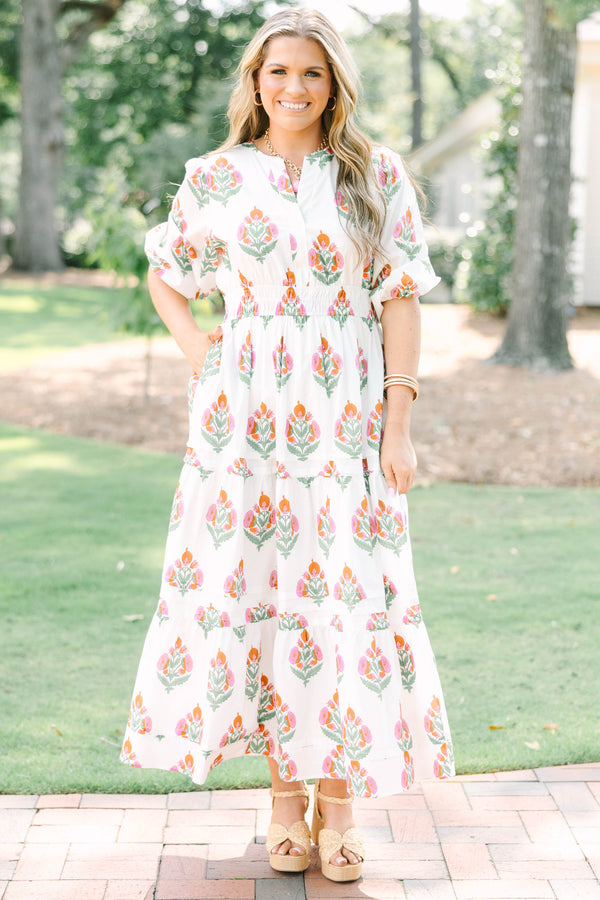 Plus Size white floral tiered maxi dress with short puff sleeves and a v-neckline.