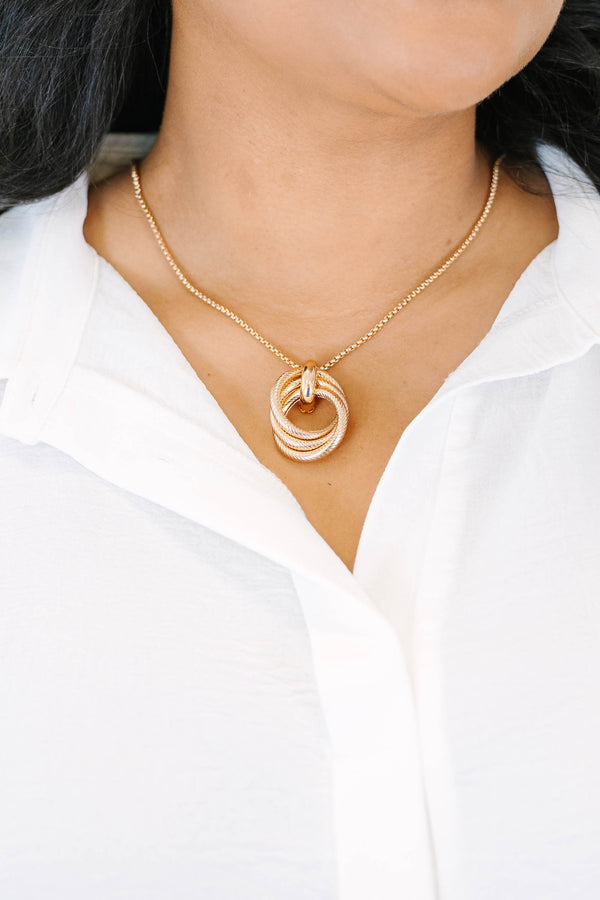 Plus Size gold necklace with three interlocking textured circles on a delicate chain.