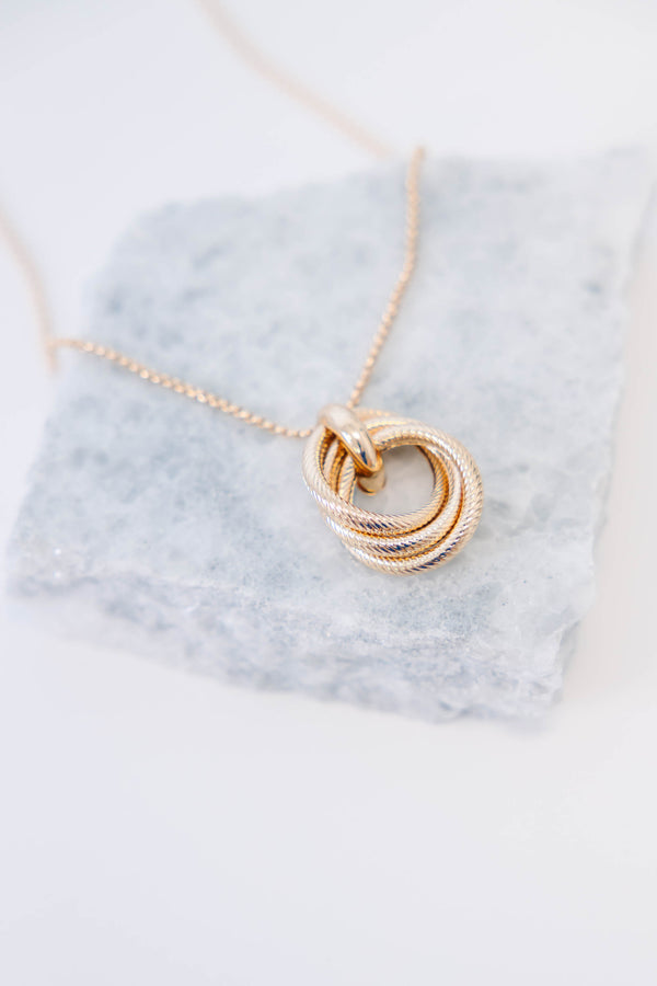 Plus Size gold necklace with three interlocking textured circles on a delicate chain.