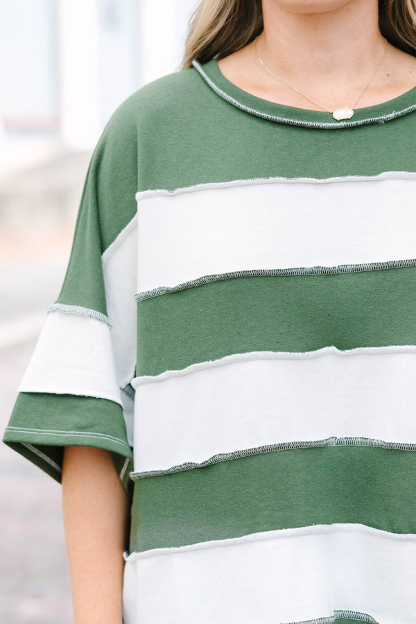 Plus Size army green and white striped French terry top with exposed seams and a relaxed fit.