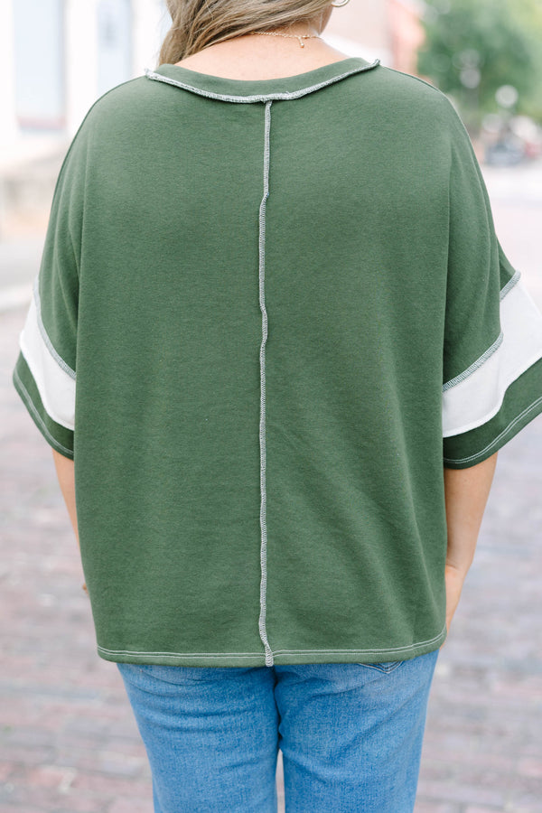Plus Size army green and white striped French terry top with exposed seams and a relaxed fit.