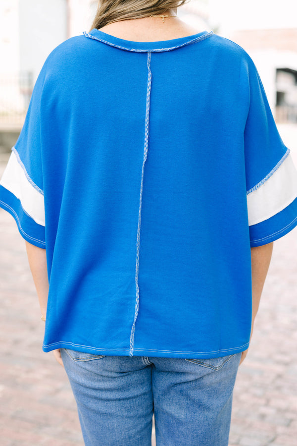 Plus Size ocean blue and white striped French terry top with exposed seams and a relaxed fit.