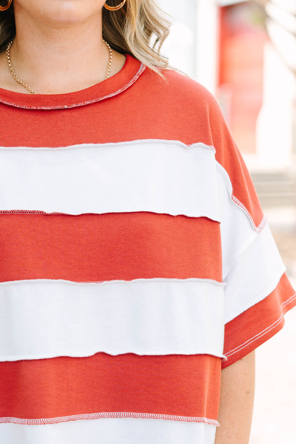 Plus Size rust and white striped French terry top with exposed seams and a relaxed fit.