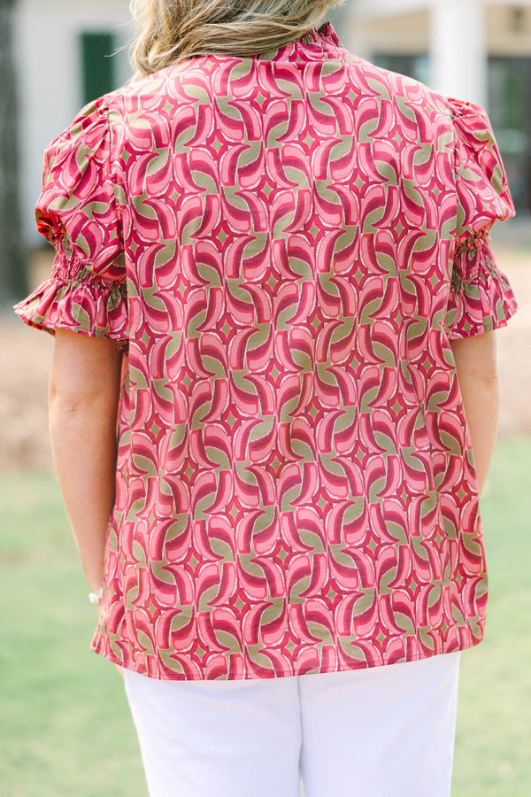 Plus Size wine-colored cotton top with a geometric pattern, V-neckline, and puffed short sleeves.