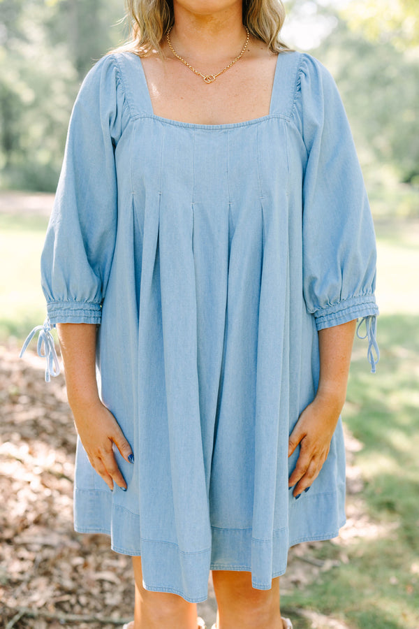 Plus Size light blue denim-look dress with a square neckline, pleated bodice, and puff sleeves.