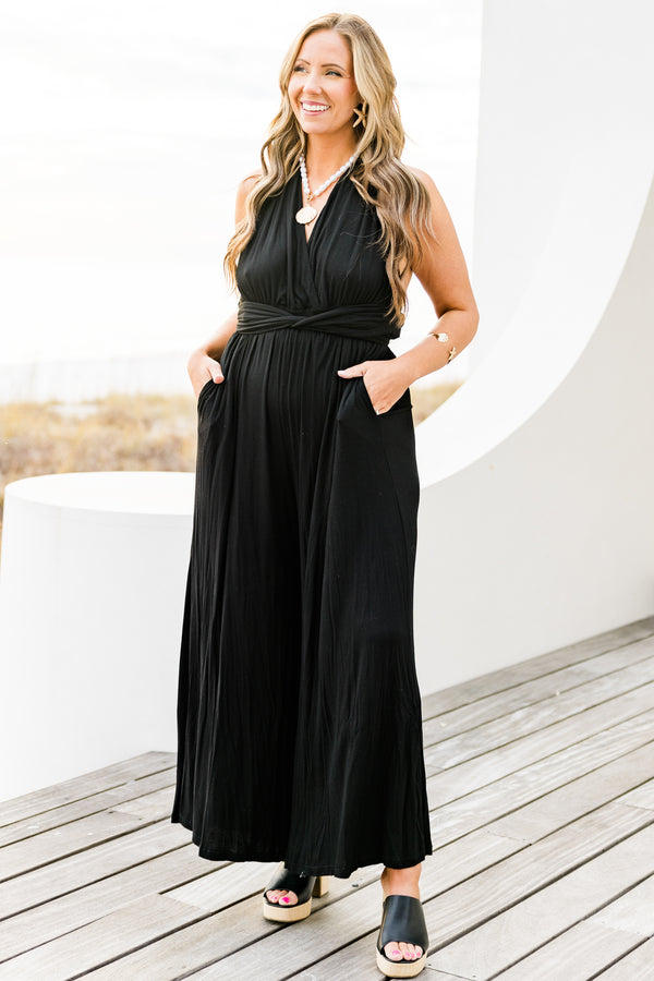 Chic Soul plus size clothing, black sleeveless jumpsuit with wide leg and tie waist detail with v neckline and tie detail on the back with pockets