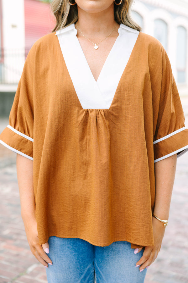 Plus Size brown tunic blouse with a white V-neck collar, relaxed fit, and white trim on the sleeves.