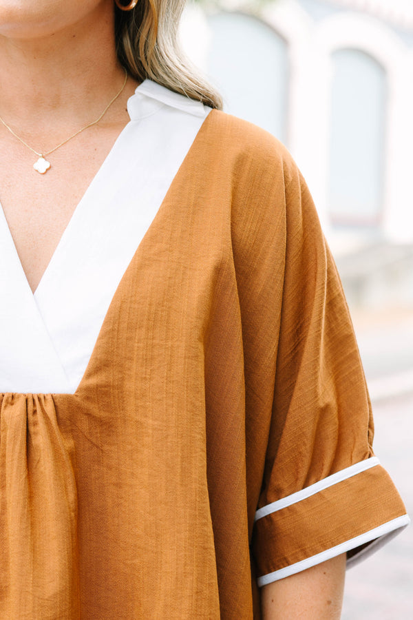 Plus Size brown tunic blouse with a white V-neck collar, relaxed fit, and white trim on the sleeves.