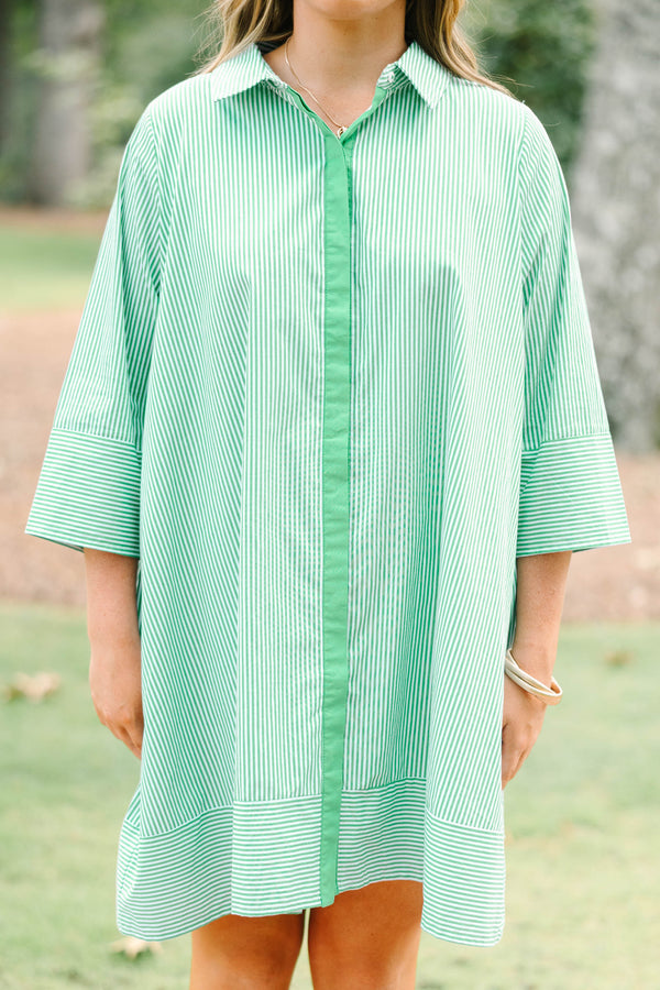 Plus size green and white striped cotton shirt dress with three-quarter sleeves and a flowy fit.