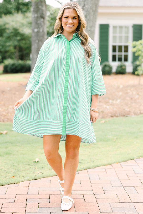 Plus size green and white striped cotton shirt dress with three-quarter sleeves and a flowy fit.