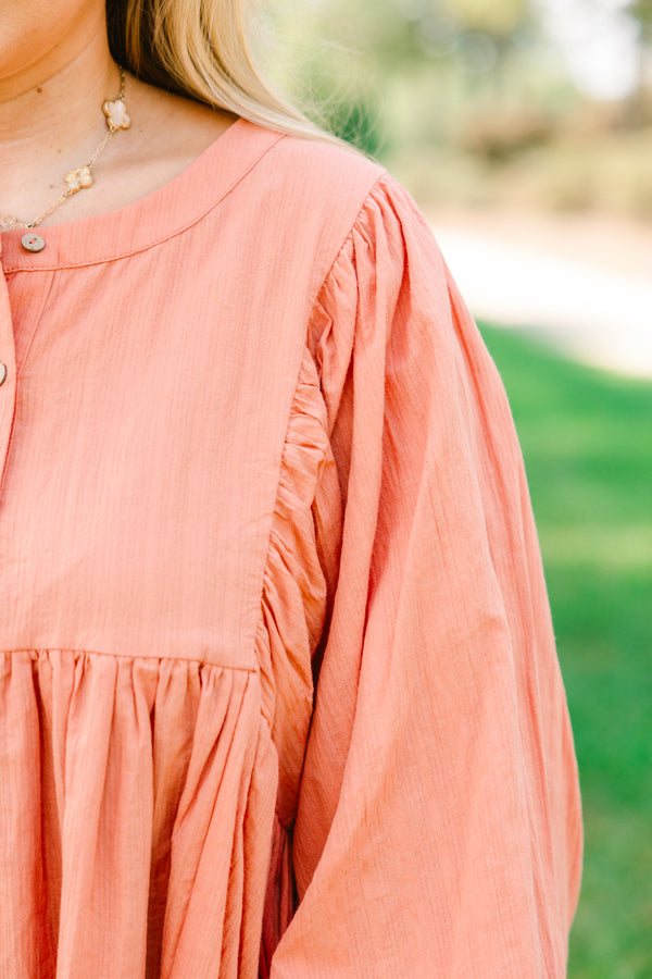 Chic Soul plus size clothing, salmon pink long sleeve button up top with ruffles on the end of the sleeves
