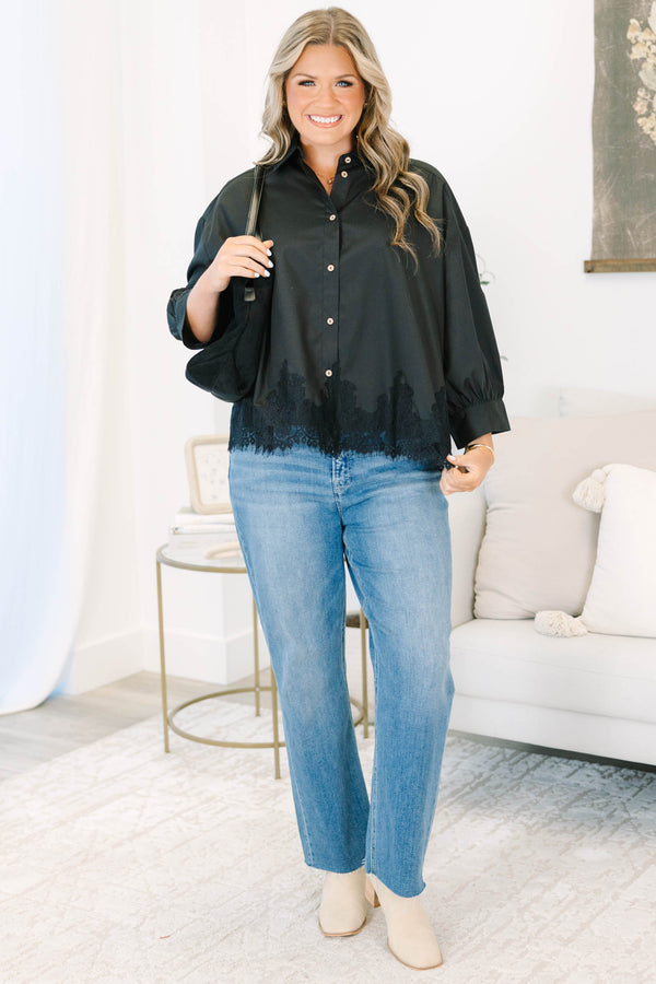 Plus size black button-down top with a flowy fit and delicate lace hem detail.