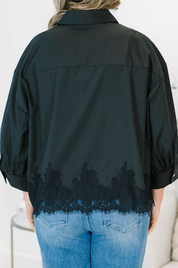 Plus size black button-down top with a flowy fit and delicate lace hem detail.