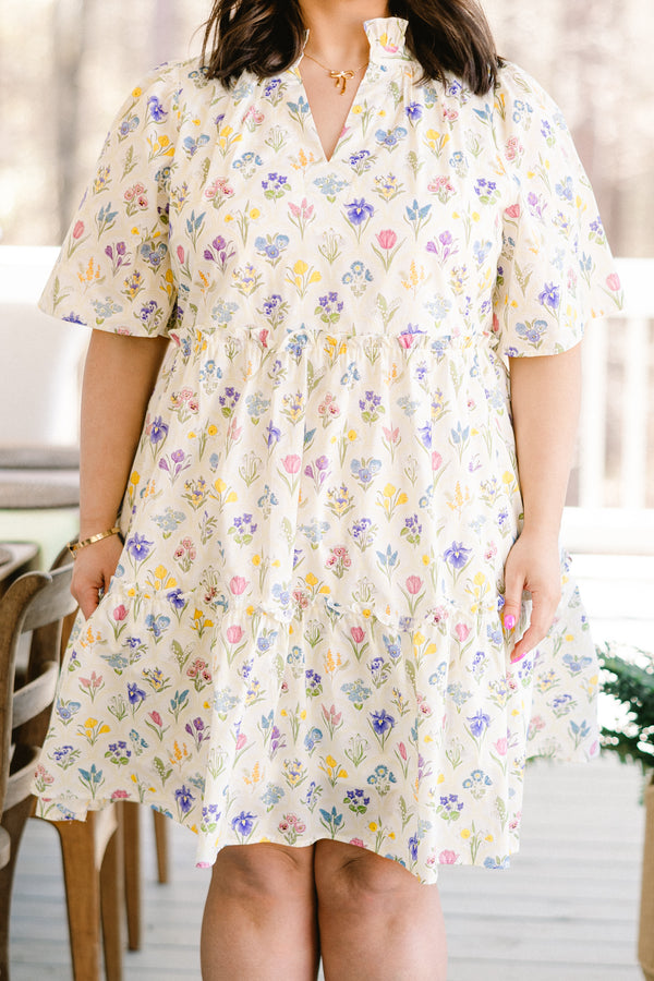 Chic Soul plus size clothing, short-sleeve white ruffled baby doll dress with a split-v-neckline and a multi-colored floral pattern