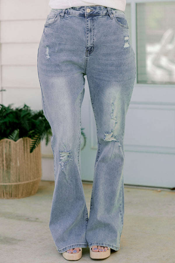 Chic Soul plus size clothing, light-wash flare jeans with a distressed look and holes in the knees