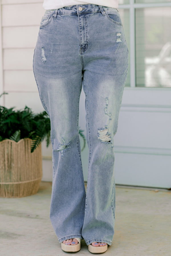Chic Soul plus size clothing, light-wash flare jeans with a distressed look and holes in the knees