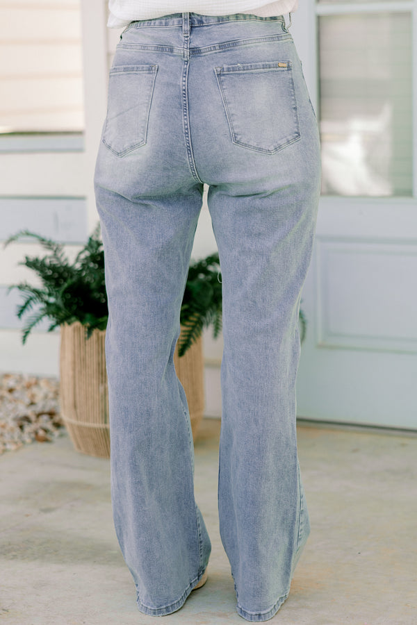 Chic Soul plus size clothing, light-wash flare jeans with a distressed look and holes in the knees