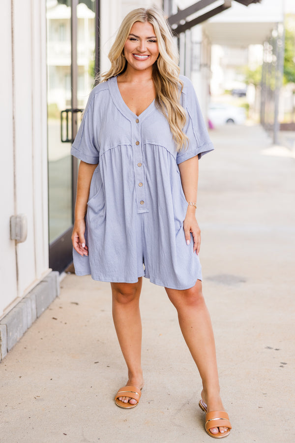 Chic Soul plus size clothing, short-sleeve dusty blue romper with  v-neckline and light brown button detailing with distressed stitching and side-pockets 