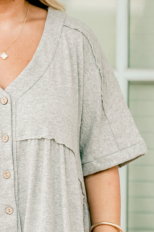 Plus Size heather grey short sleeve romper with a V-neckline and functional front buttons.