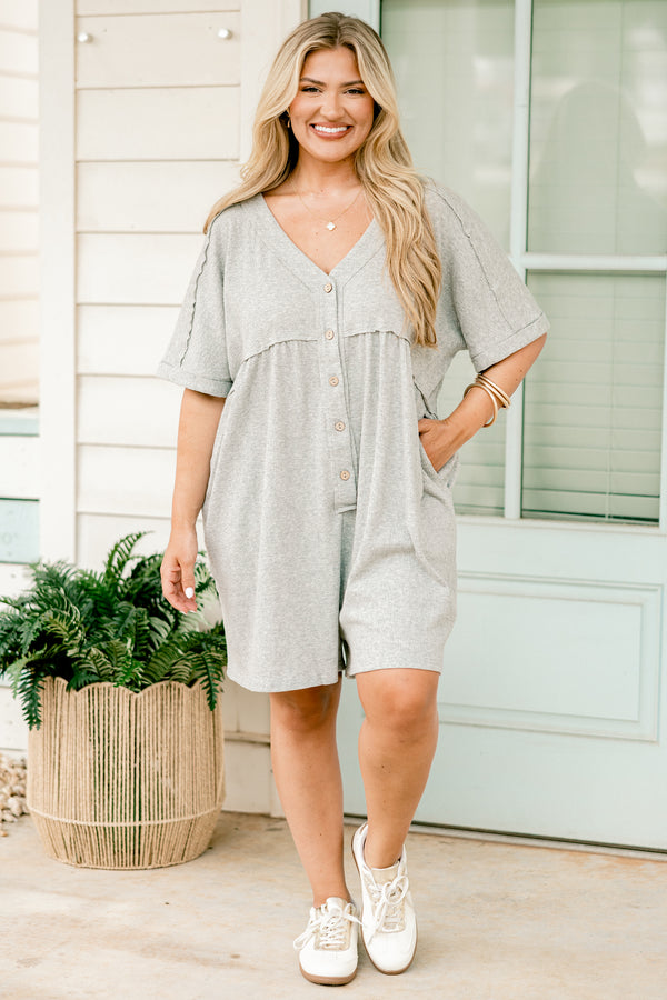 Plus Size heather grey short sleeve romper with a V-neckline and functional front buttons.