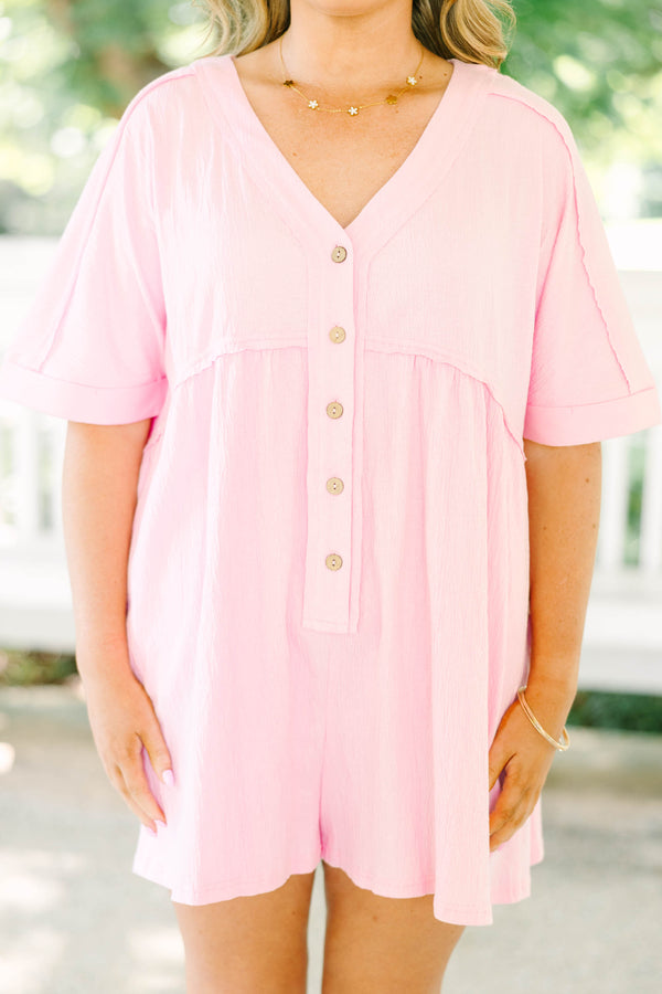Plus Size orchid pink short sleeve romper with a V-neckline and button-down front detail.