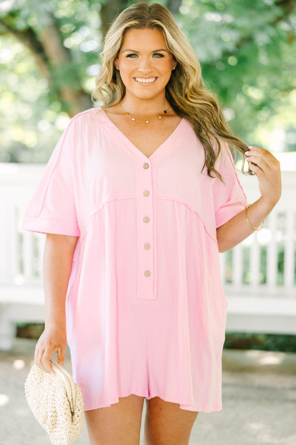 Plus Size orchid pink short sleeve romper with a V-neckline and button-down front detail.