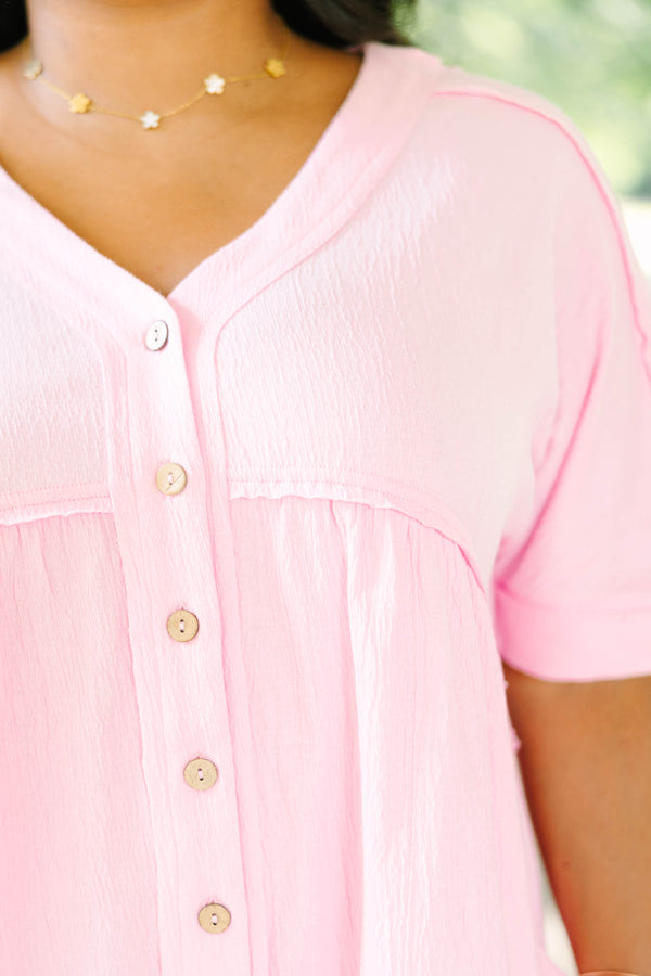 Plus Size orchid pink short sleeve romper with a V-neckline and button-down front detail.