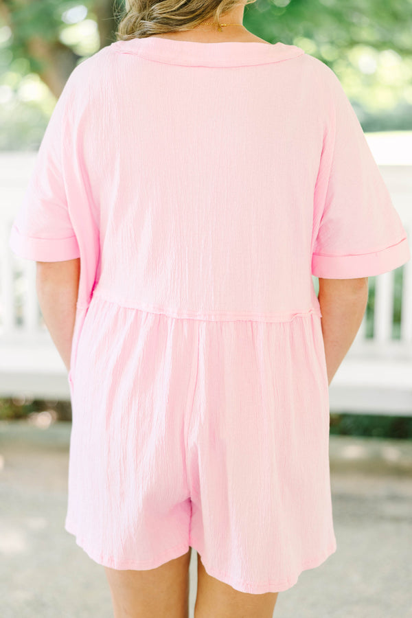 Plus Size orchid pink short sleeve romper with a V-neckline and button-down front detail.
