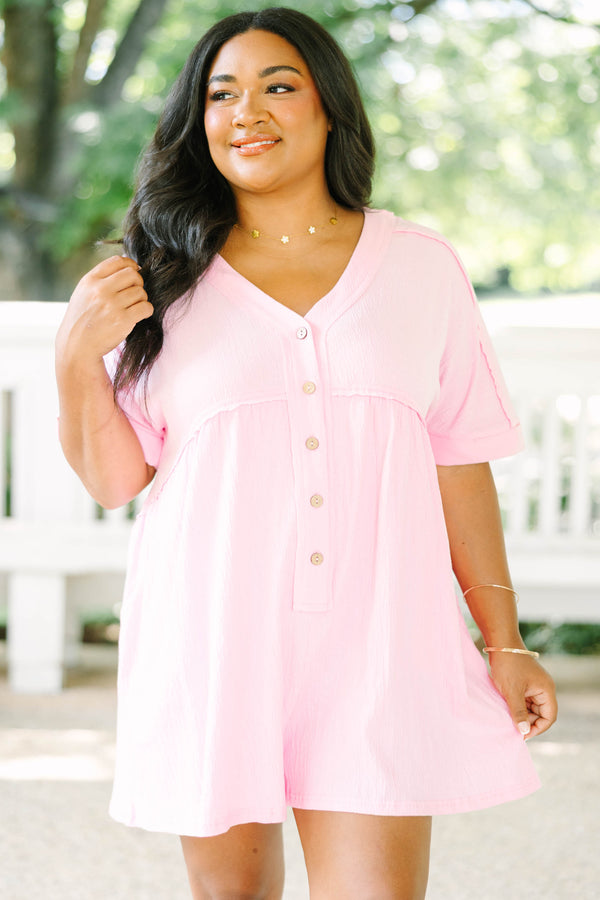 Plus Size orchid pink short sleeve romper with a V-neckline and button-down front detail.
