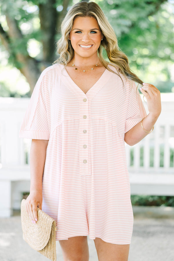 Plus size pink and white striped romper with a flowy fit, V-neck, and functional front buttons.
