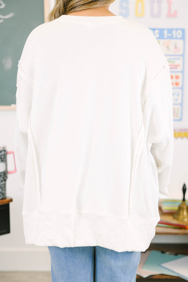 Plus size ivory oversized sweatshirt with blue graphics that say 