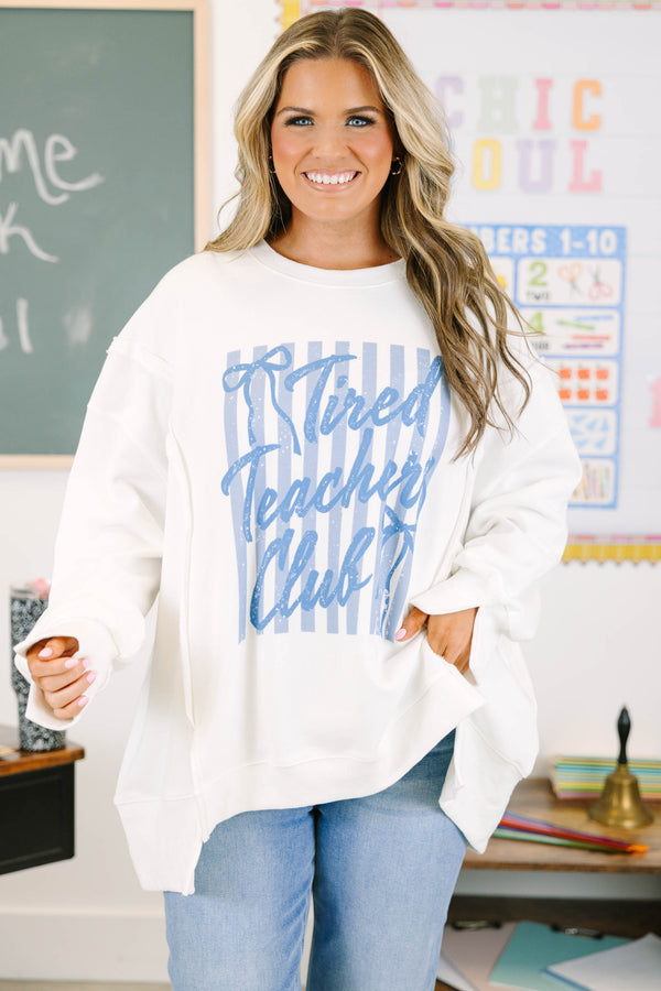 Plus size ivory oversized sweatshirt with blue graphics that say 