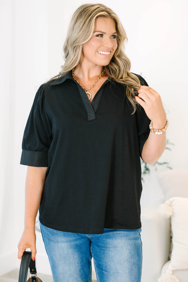 Plus Size black collared top with a v-neckline and puffed half-sleeves with cuffed finishes.