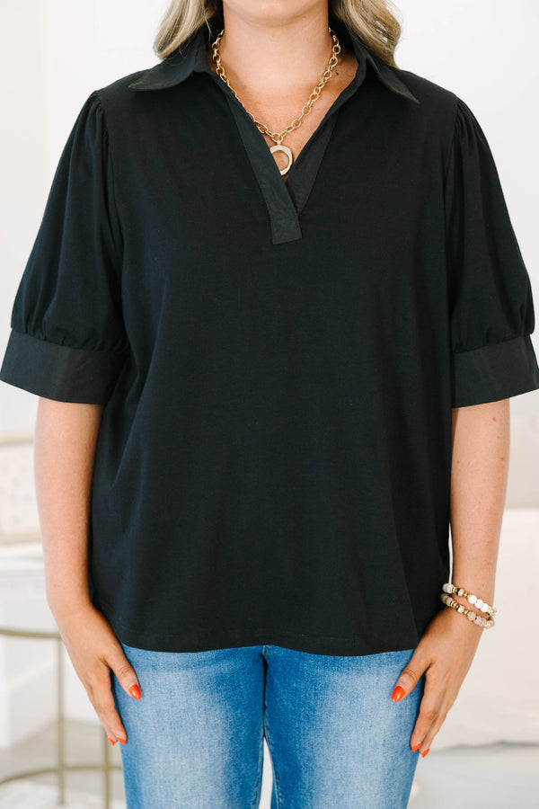 Plus Size black collared top with a v-neckline and puffed half-sleeves with cuffed finishes.
