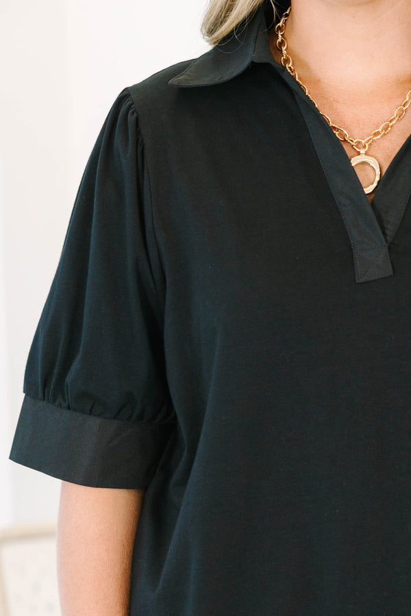 Plus Size black collared top with a v-neckline and puffed half-sleeves with cuffed finishes.