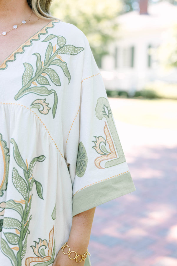 Plus size top in olive, a flowy 100% cotton boho blouse with intricate embroidery.