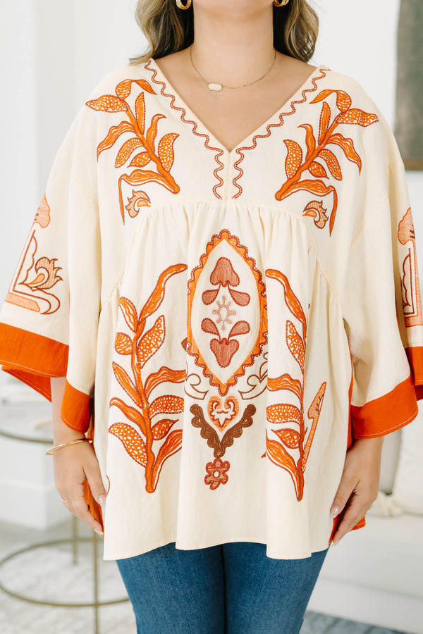 Plus size clothing, cream colored tunic top with orange embroidery