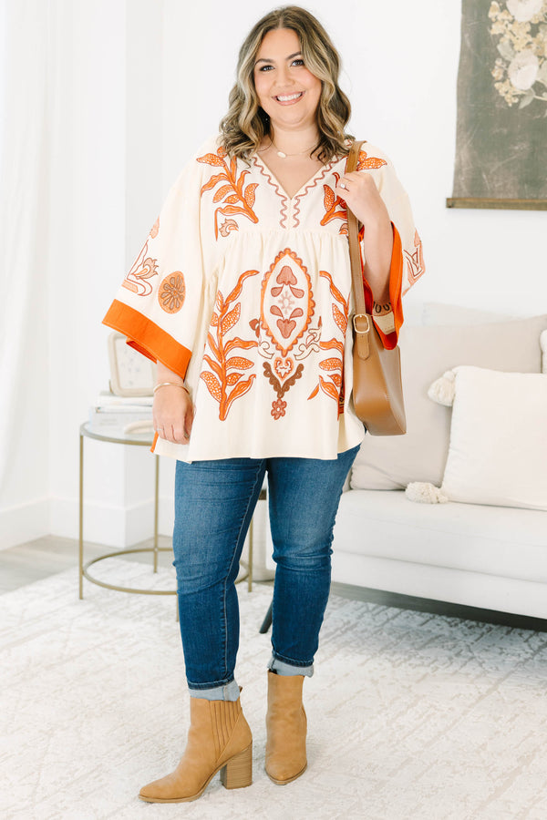 Plus size clothing, cream colored tunic top with orange embroidery