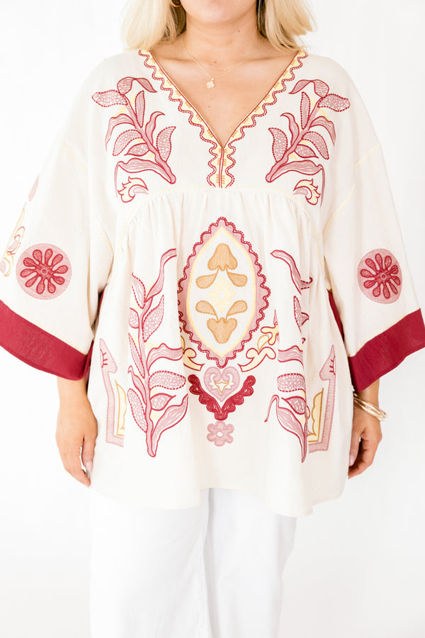 Chic Soul plus size clothing, ivory 3/4 bell sleeve v neck top with burgundy, pink, and gold embroidery detailing