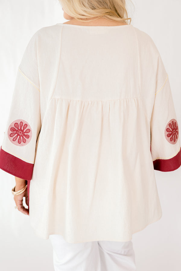 Chic Soul plus size clothing, ivory 3/4 bell sleeve v neck top with burgundy, pink, and gold embroidery detailing