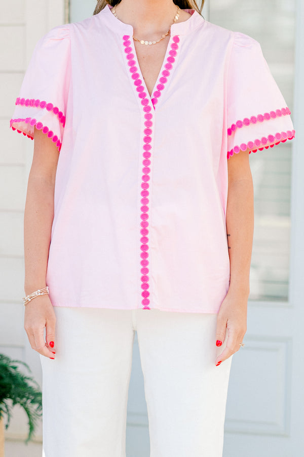 Chic Soul Plus size clothing, pink short sleeve top that has a v-neckline and polka detailing on the sleeves and throughout the neckline 