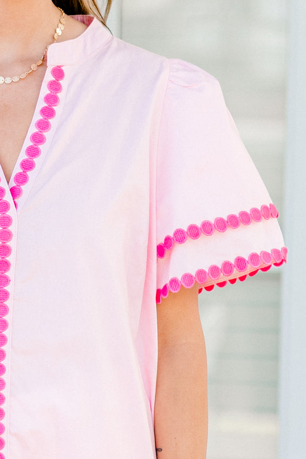 Chic Soul Plus size clothing, pink short sleeve top that has a v-neckline and polka detailing on the sleeves and throughout the neckline 